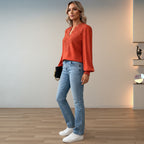 Women's long-sleeve V-neck blouse – polka dot pattern with ruffle cuffs